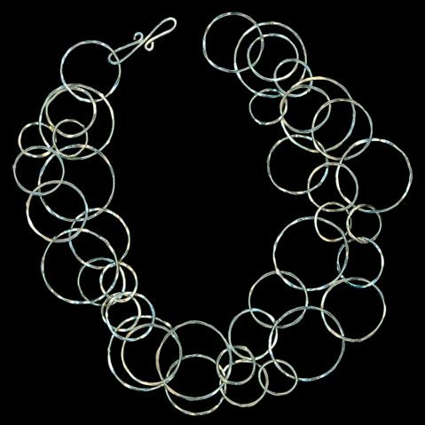 Silver color double layer necklace on the black background